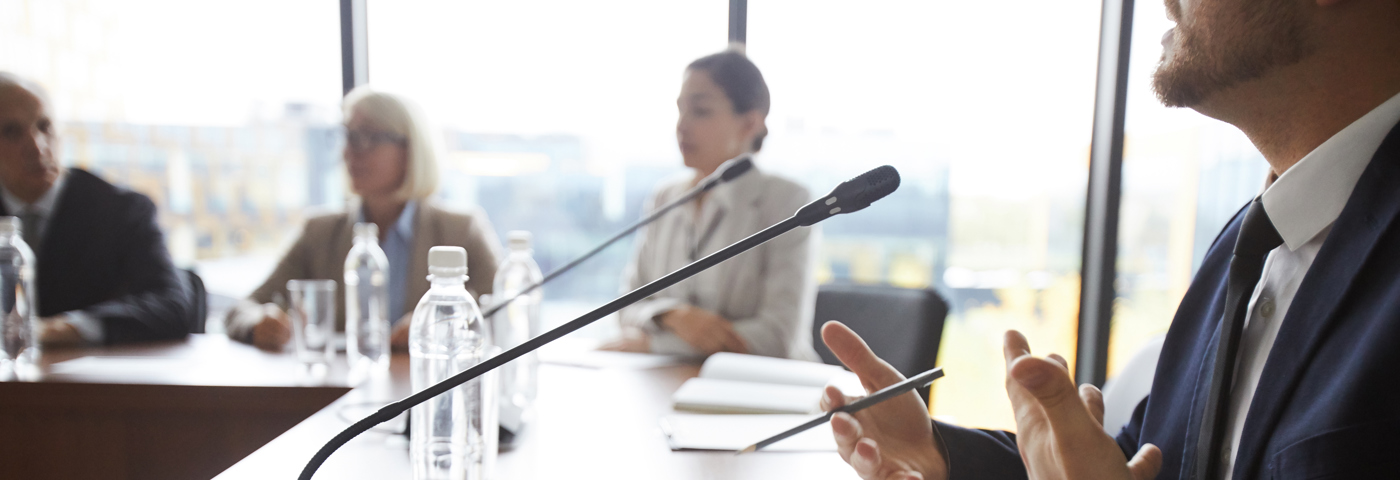 Speaker at conference table